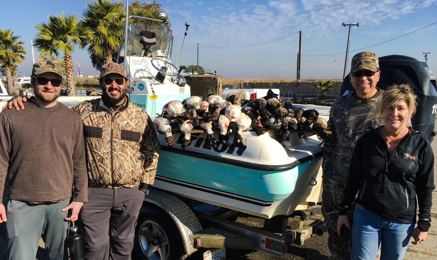 Our group with the morning's harvest of Goldeneyes and Blue Bills